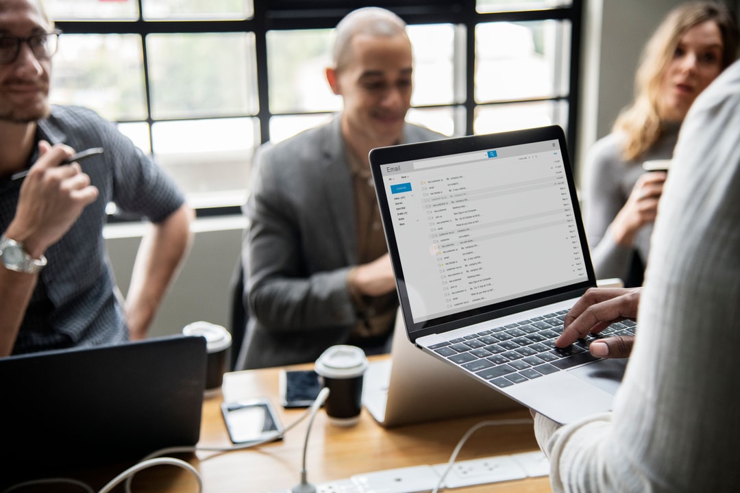 Small sales team working together in startup office